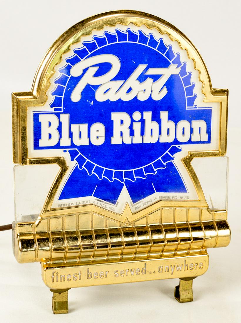 Pabst Blue Ribbon Alcohol Advertising Sign: A small light up sign advertising Pabst Blue Ribbon with the bold statement "finest beer served ..anywhere". International Association of Machinists label on back and frame stamped "360001". Sign does
