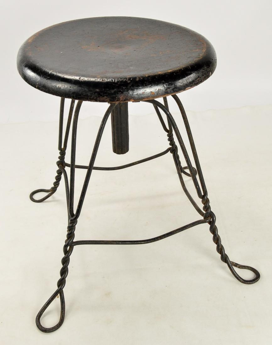Classic Round Wood Seat 4-Leg Piano Stool: Classic style round piano stool has oak top, see photo, beautiful ice cream parlor-style legs with heavy metal center shaft, painted black with some worn paint areas, nice condition.