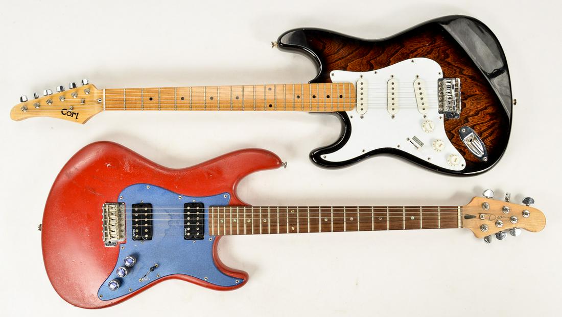 Lot of a Cort Guitar and a Dean Guitar: This lot contains a Cort Strat Style guitar and a Dean Guitar. The Cort guitar is a left handed guitar but it is strung for a right handed player. Making it interesting as the dials and lever are abov