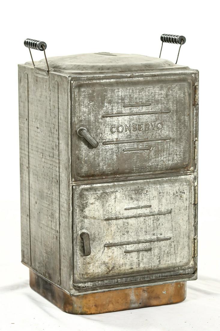 Vintage Conservo Oven/Cooker: A two door, cooker/oven named the "Conservo" and made by the Toledo Cooker Company. Top door is marked "Conservo" in raised lettering. Top is dented and exterior is dirty. Doors open without issue and