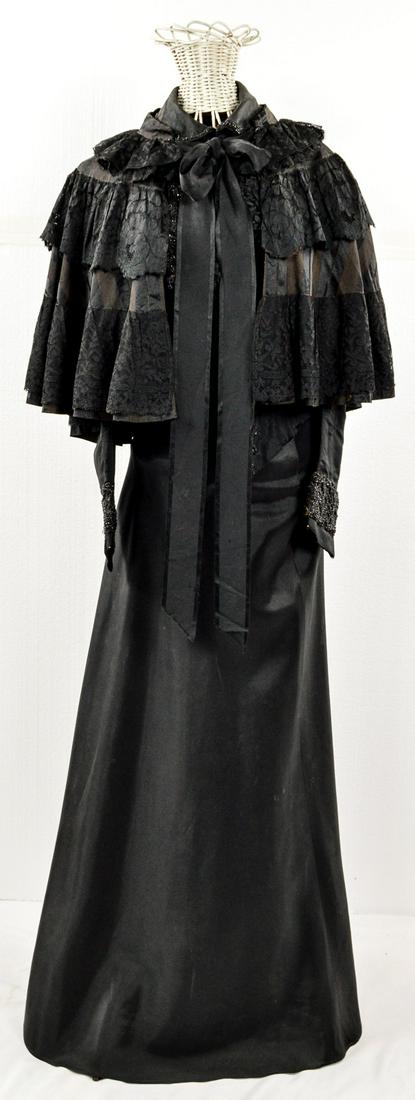 Turn of the Century Women's Dress: Very nice black dress with small beads along the collar and front. Comes with bow and a small cape. Opens from the front via hooks and loops. Size appears to be a small. Overall very good to excellent
