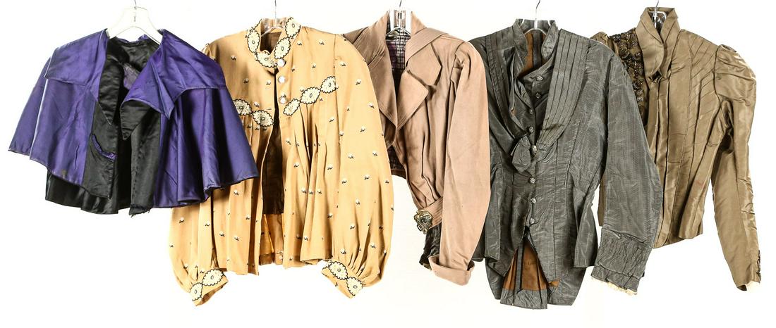 Five 1800's Women's Tops: 1. Purple and black caplet, right hand side pocket. Star collar. Excellent condition. 2. Heavily embroidered top jacket. Wool with incredible embroidery. Full sleeves, pleated throughout. Carved mothe