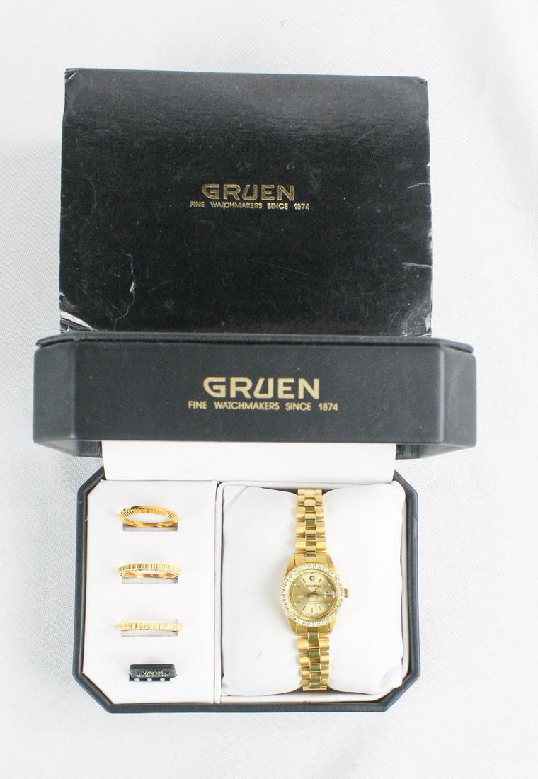 Gruen Ladies Wrist Watch New In Box: Gruen ladies wrist watch in gold new in box. Comes with 4 interchangeable bezels.