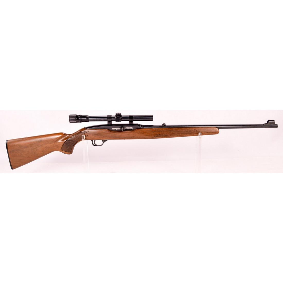 Winchester Model 490 Rifle .22LR SN: J016847 (M): A Winchester Model 490 semi automatic rifle made in Canada and chambered in .22LR. Rifle is fitted with Weaver V22-A scope with clear optics. 24" barrel has hooded front sight and flip up rear sight. 