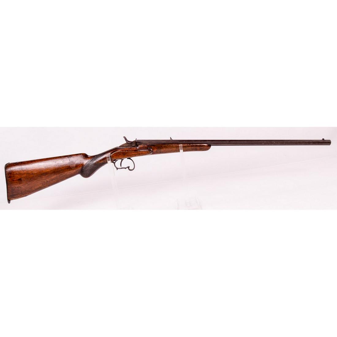 Belgian Single Shot Rifle .22 SN: 2680 (C): A single shot rolling block style rifle made in Belgium and chambered in .22. Rifle is marked "Belgium" on bottom barrel flat just ahead of stock along with the serial number. Left side of barrel is m