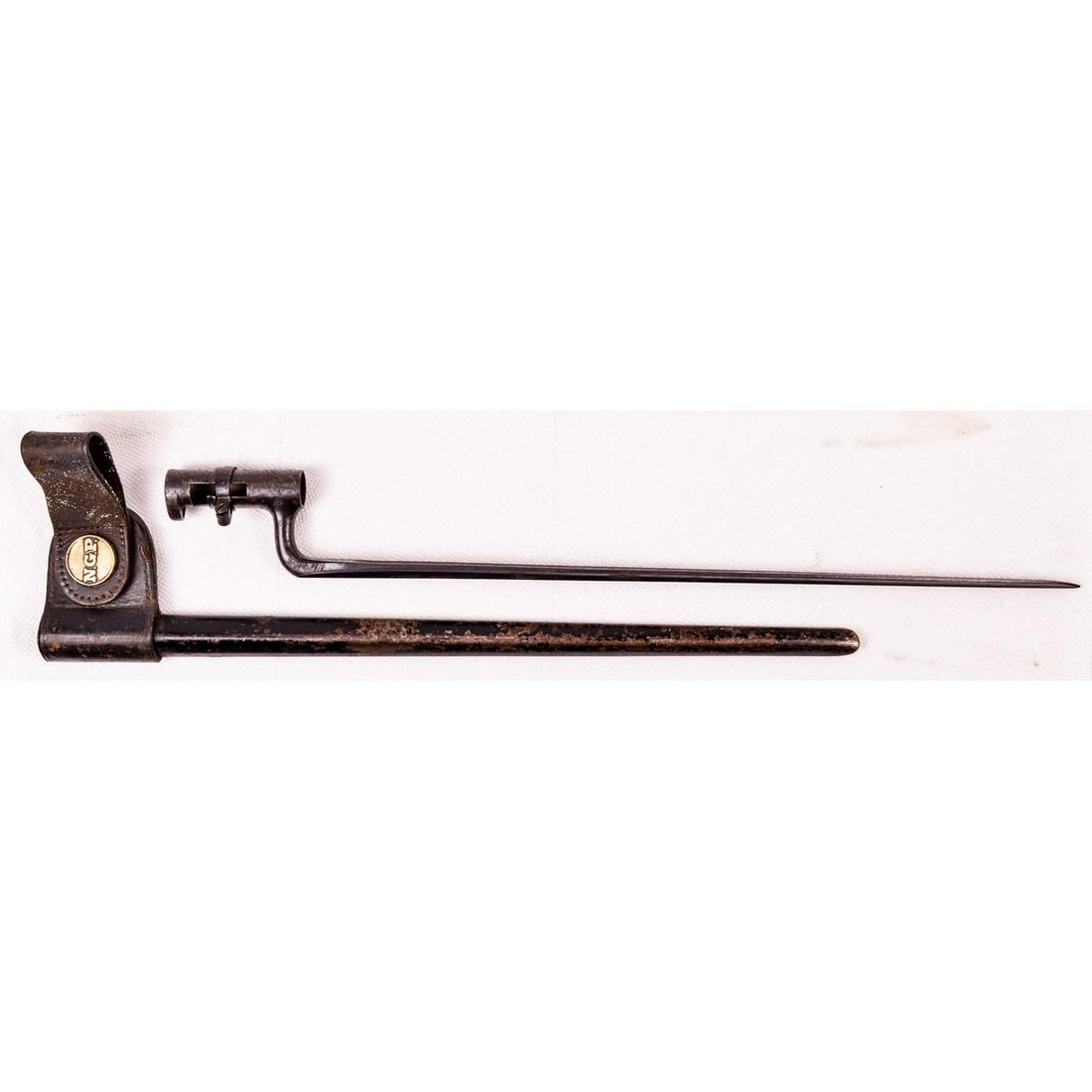 Model 1873 US Socket Bayonet: Stamped "US" on rusted blade. Both socket and blade show heavy use and rusting. Scabbard retains 80% of black paint. Leather frog with National Guard PA roundel in good shape.