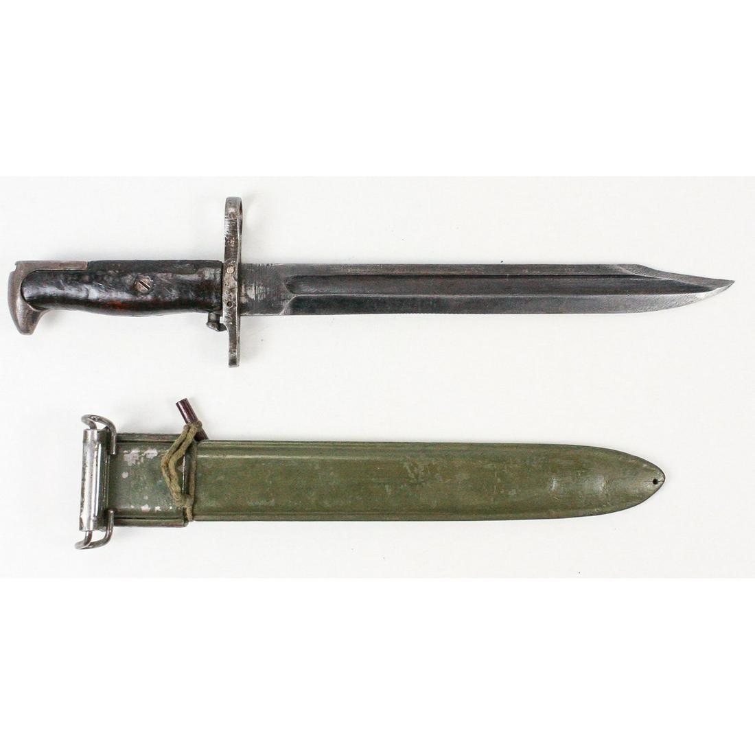 WWII US M1905 Bayonet: Stamped UFH and dated "1942". Cut down to 10" blade with Bowie point. Wooden handles are numbered "130". Bayonet and scabbards show wear. Very unusual locking peg for muzzle ring attached to scabbard.