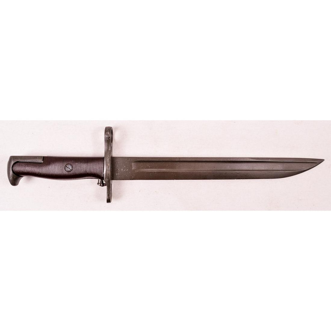 US M1905 Springfield Armory Bayonet: Dated "1918". Cut down to 9.875" blade length with knife point. Numbered "844702". Rare brown plastic grips. Blade and grips in exceptional condition. No scabbard.