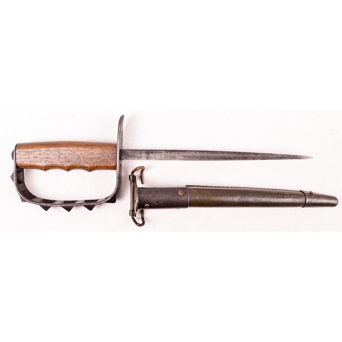 WWI US Model 1917 Trench Knife: WWI US Model 1917 spike bayonet with leather scabbard. Used for hand to hand combat in trenches. Has triangle spike blade with spiked knuckles. Hand guard marked "US L.F & C 1917" for Landers Frary an