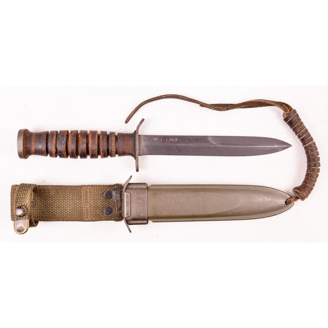 WWII US M3 Trench Knife: US M3 trench knife. Edge and point of the blade are very sharp and blade length is 6.5" long. Blade is marked "US M3 Case". Scabbard comes with canvas frog and retains 98%+ of original green paint. Ov