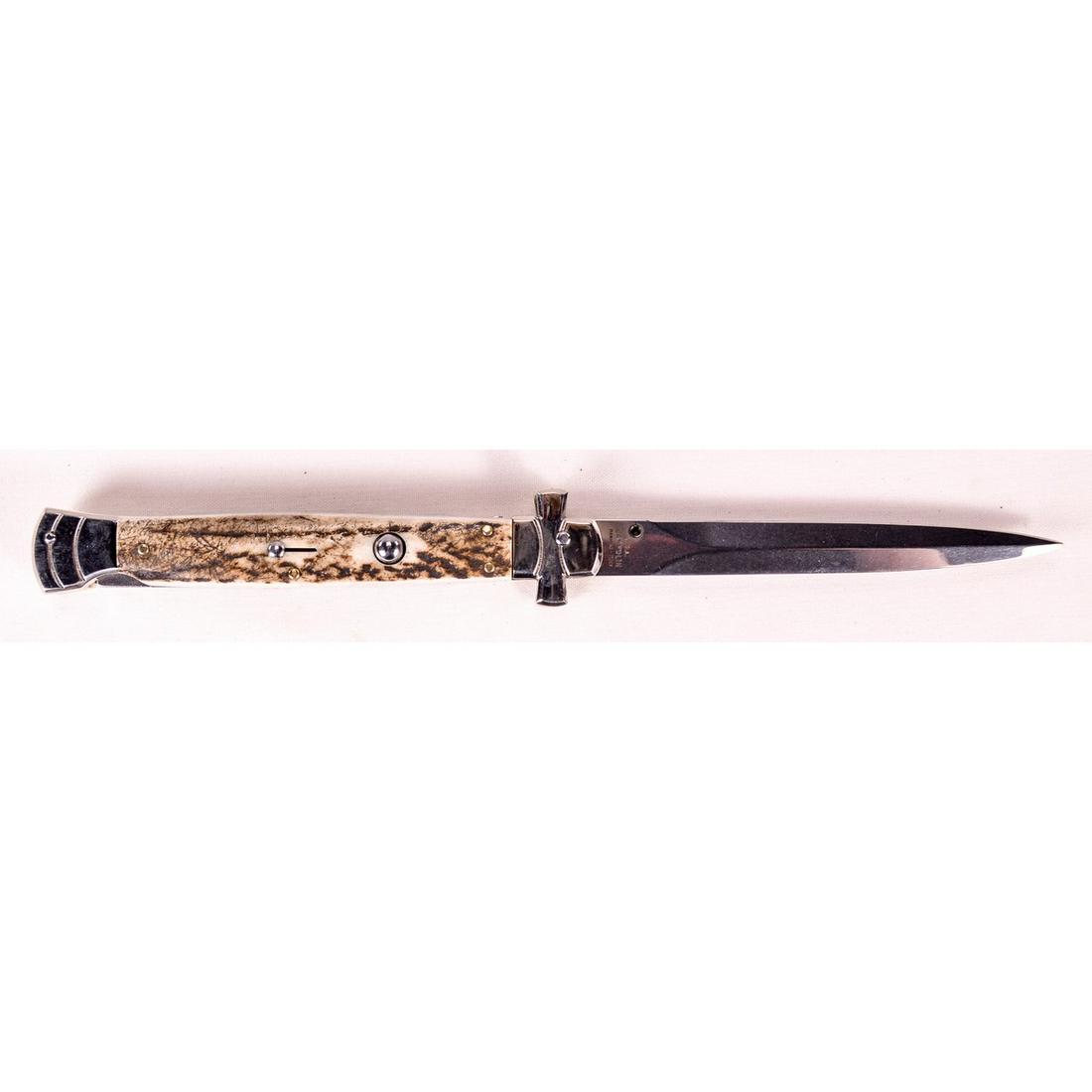 11" Maltese Cross Switchblade: 11" Maltese Cross lock back switchblade with genuine stack horn. Maker A.G.A. Campolin, Maniago, Italy. New condition.