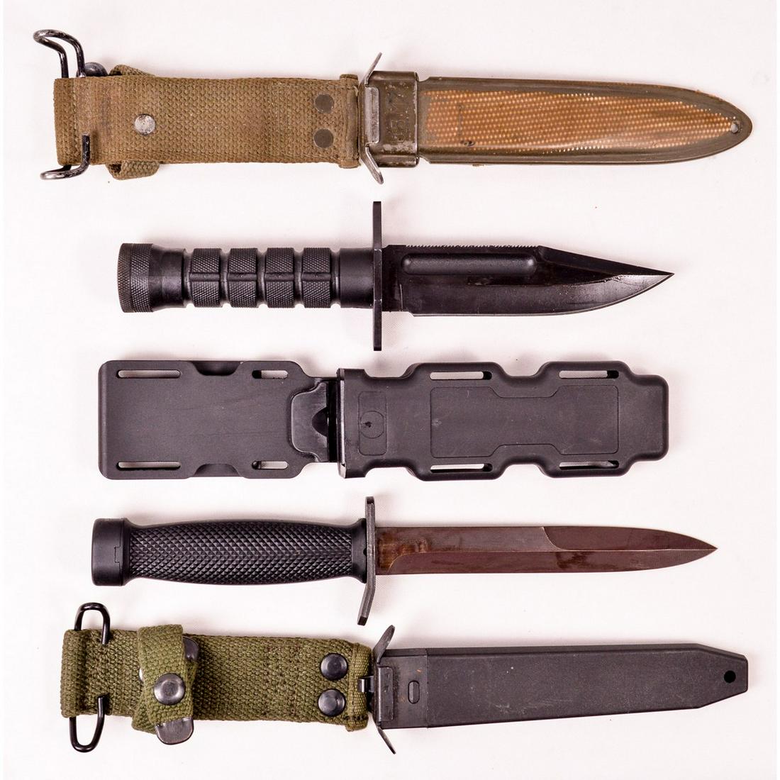 Lot of 2 Knives and 1 Scabbard: Foreign made M4 type knife with 6.5" blade in new condition with scabbard, an unmarked well made fighting knife with 5.25" blade in plastic scabbard, and a US M8 scabbard in good condition BMCO mfg.
