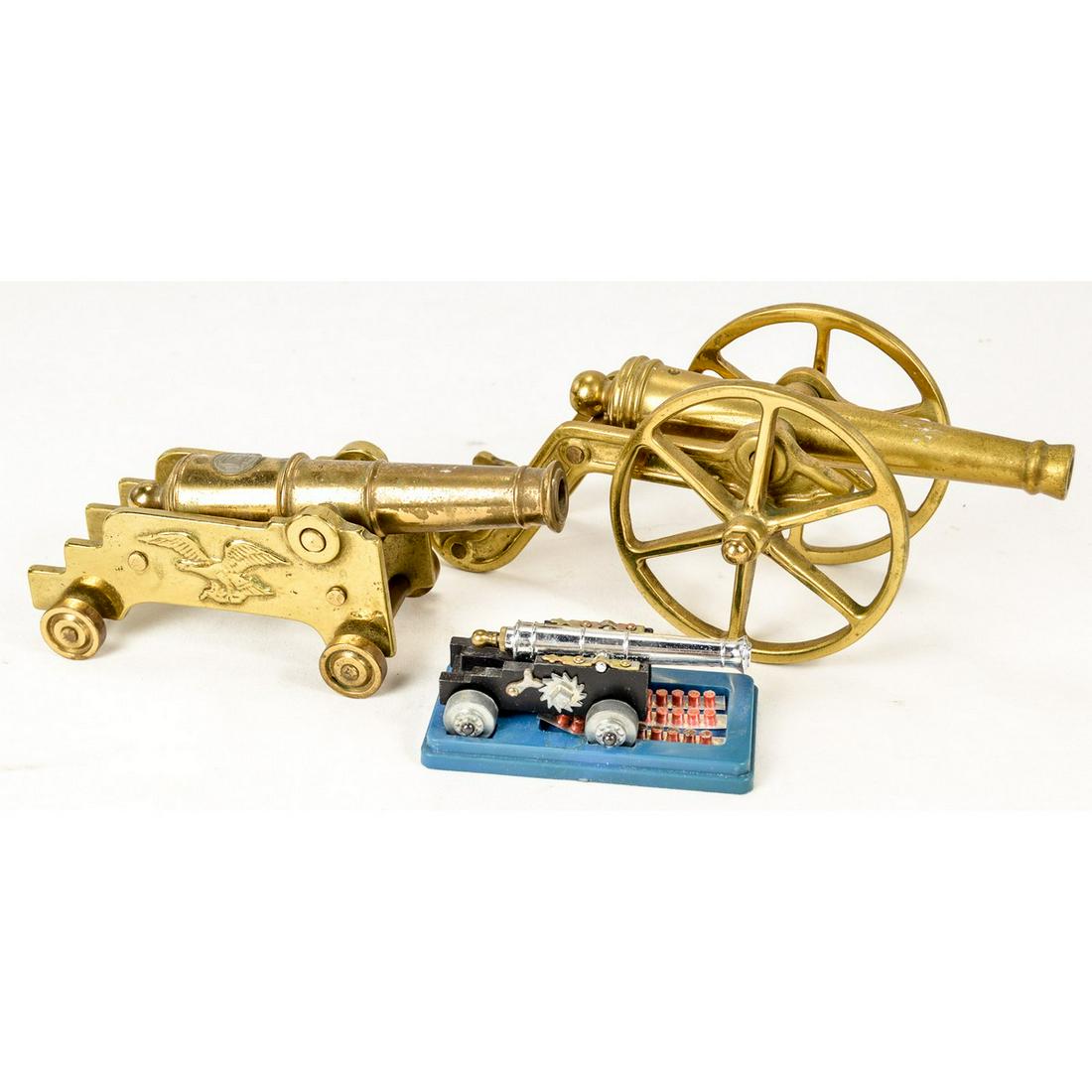Lot of 3 Display Cannons: Lot of 3 Civil War era display cannons. 2 larger ones are made from brass while the smaller one is a cap gun. All in used condition and come as is. See photos.