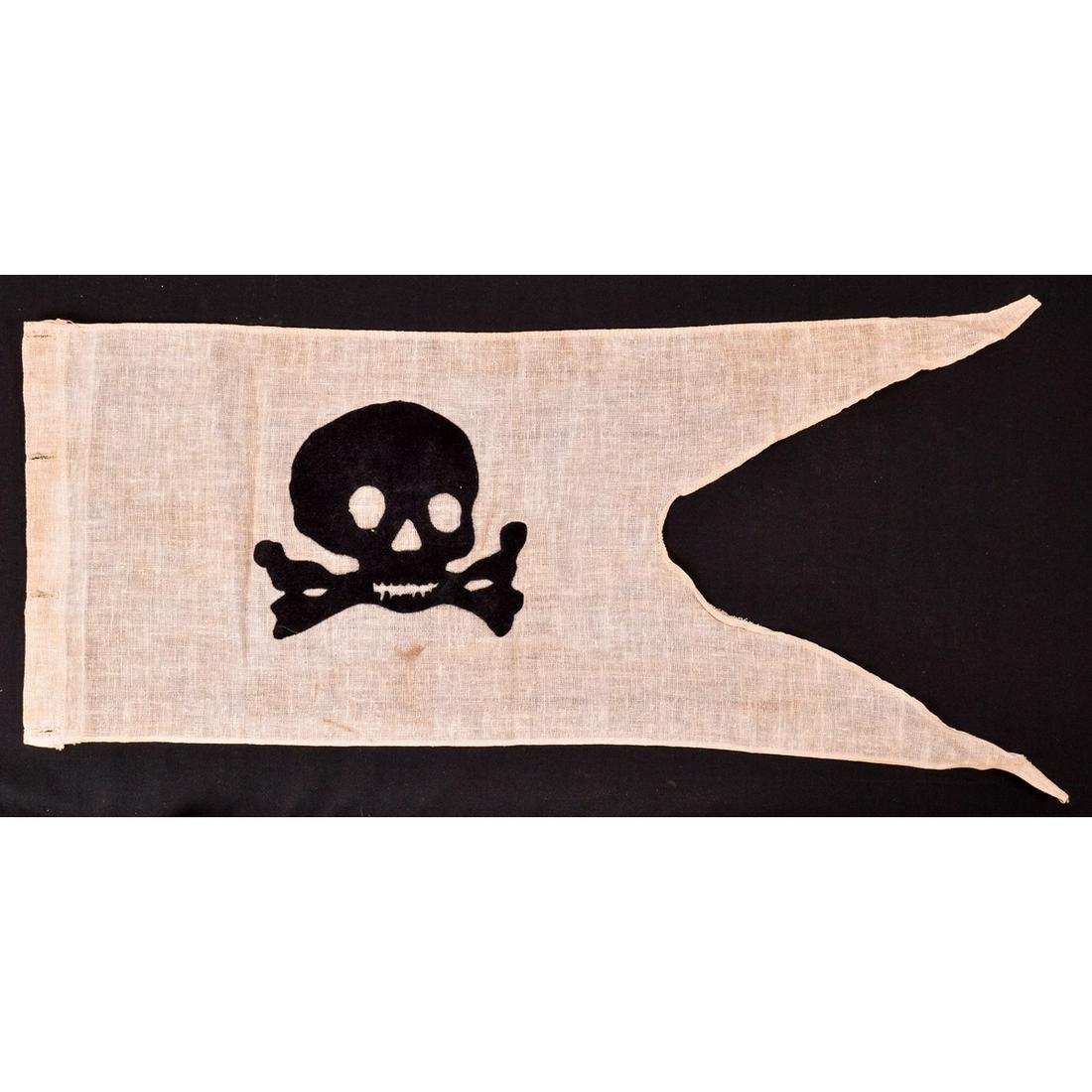 Totenkopf Flag WWI - Current Production: This lot is one Totenkopf WWI Flag. This Hussar cavalry lance pennant is in good used condition. No rips or tears. Small smudge stain under skull. Measures 29" x 11.25". Made of white cotton with a bl
