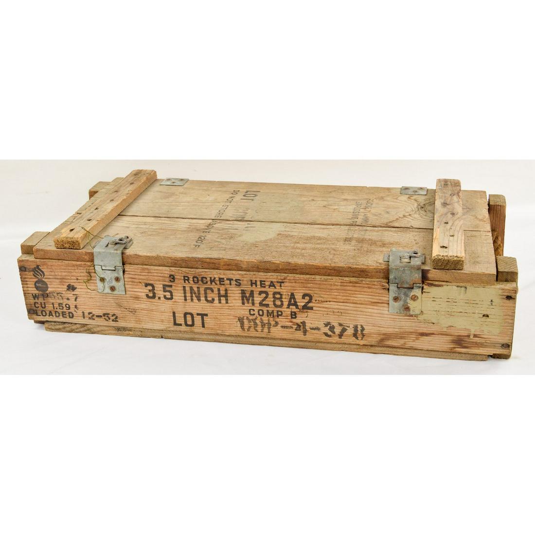 US Military Wooden Ammo Crate: US Military wooden ammo crate for the M28A2 3.5" round. Crate has some wear but is still sturdy and has most of the label. Measures 29.5"L x 7"T x 14"D.
