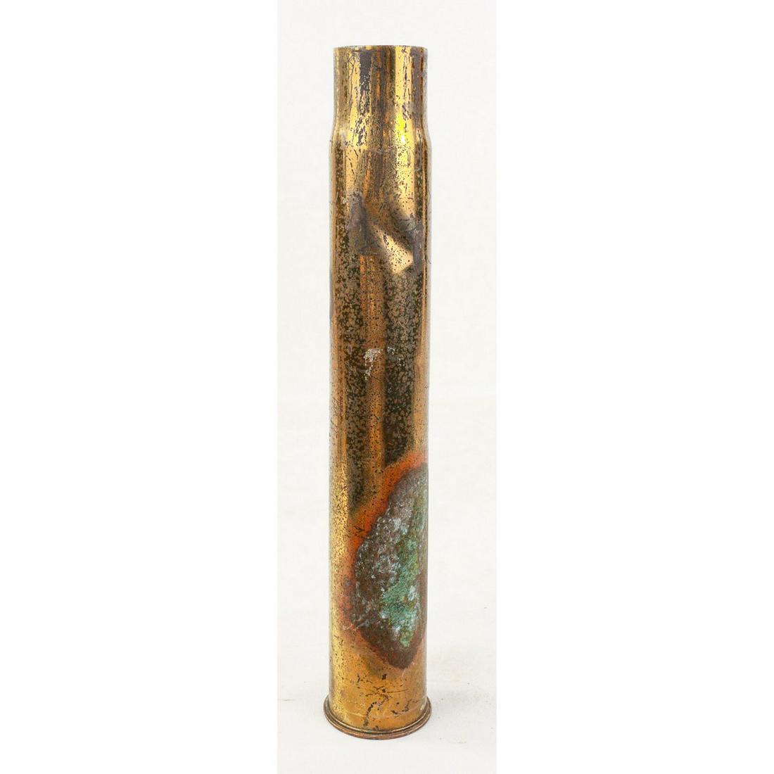 WWI French Hotchkiss 50mm Shell Casing: WWI French Hotchkiss 50mm shell casing. Marked on the bottom with 3 holes. Nice brass casing with some small dents and surface marks but good condition. Measures 14 3/4"T x 2 3/4" in diameter. See pho