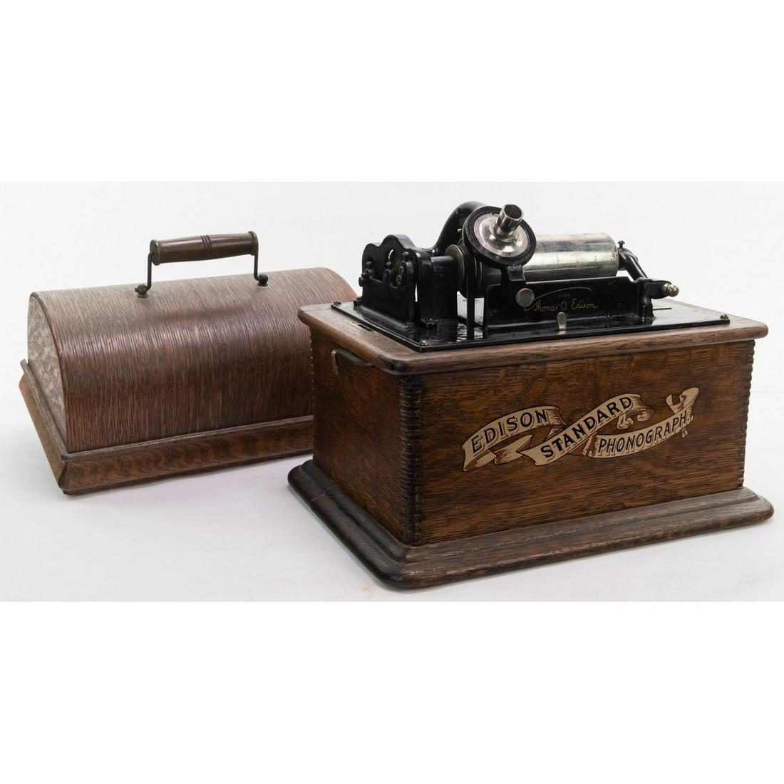 Edison Standard Cylinder Phonograph: Model A, in new style cabinet. This machine has been stripped of it's finish and redecaled. There is some separation on one side of the cover. Has original model C reproducer with a bad stylus. The up