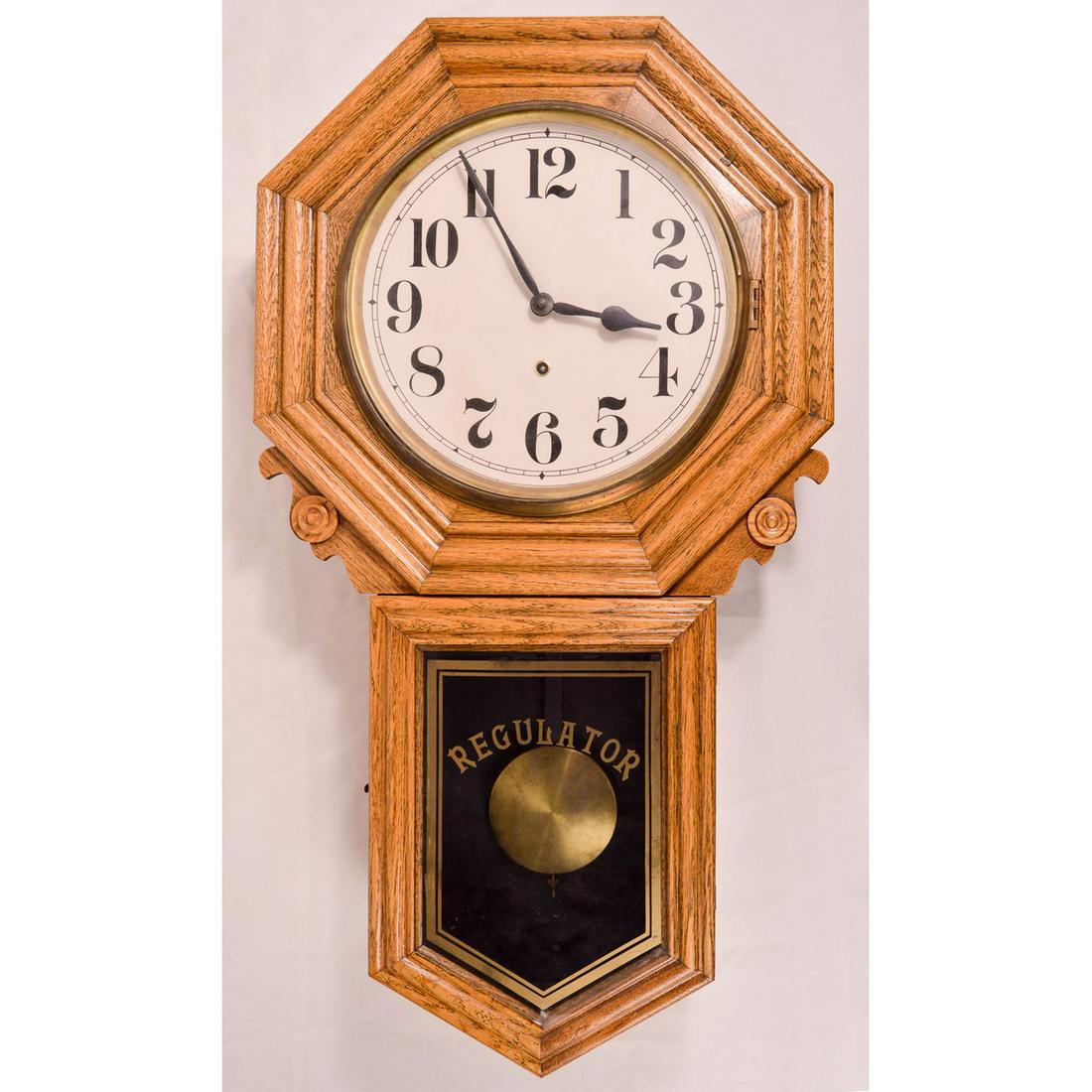 New Haven Clock Co 8 Day Erie Regulator Wall Clock: An 8 day Erie Regulator wall clock made by the New Haven Clock Company. Clock has original label on back, largely intact and legible, though stained. Clock face has hour and minute hands with Arabic n