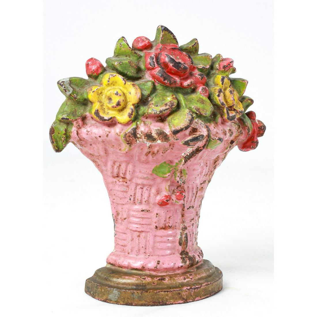 Vintage Cast Iron Flower Basket Doorstopper: Vintage flower basket doorstopper made from cast iron. No makers markings. Most of the coloring is present and stopper is overall in good condition. Circa early 20th century. See photos.