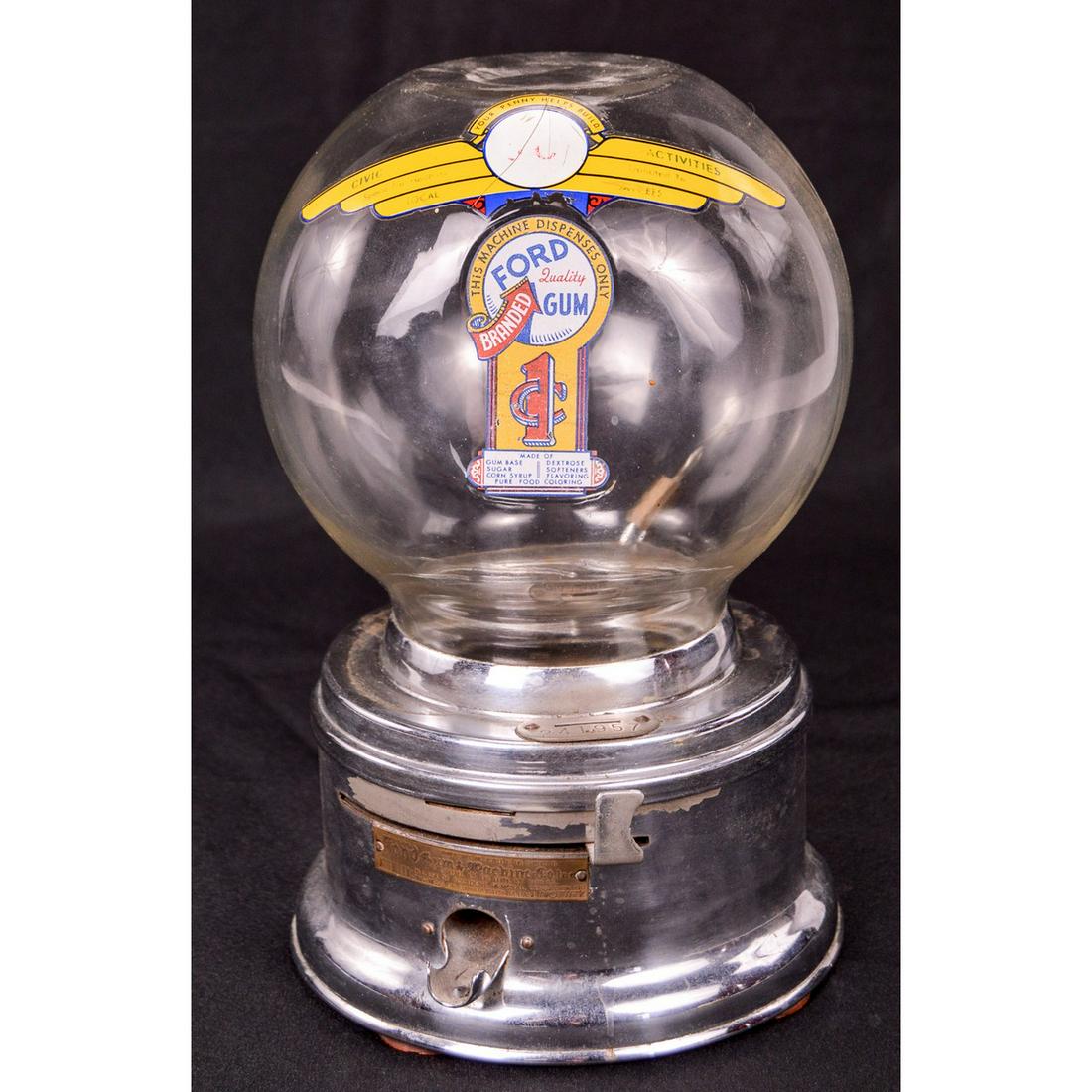 Ford Gumball Machine: Made by Ford Gum and Machine Company in the mid 20th century. The glass globe has a flat top and this style of decal is uncommon with the "branded" arrow pointing up to Ford. Machine takes 1 penny. Fr