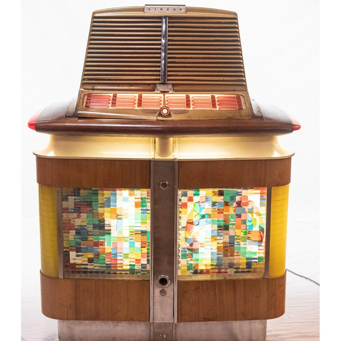 Aireon 1200A Airliner Super Deluxe Jukebox: 1200A Airliner Super Deluxe produced from 1946-47. Plays 24 78 r.p.m. records and weighs a hefty 412 lbs. As ahead of it's time in design as any box could be. recently shopped and plays well. Measures