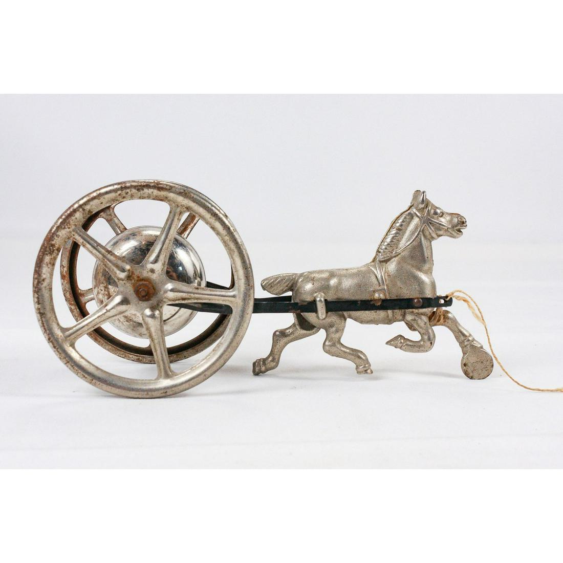 Horse Pulling Bell Vintage Toy: Appears to be in the style of early 20th century metal Horse Pulling Bell toys. The bell still dings when the horse is moved. Likely originally a pull along toy. It would only require fastening a stri