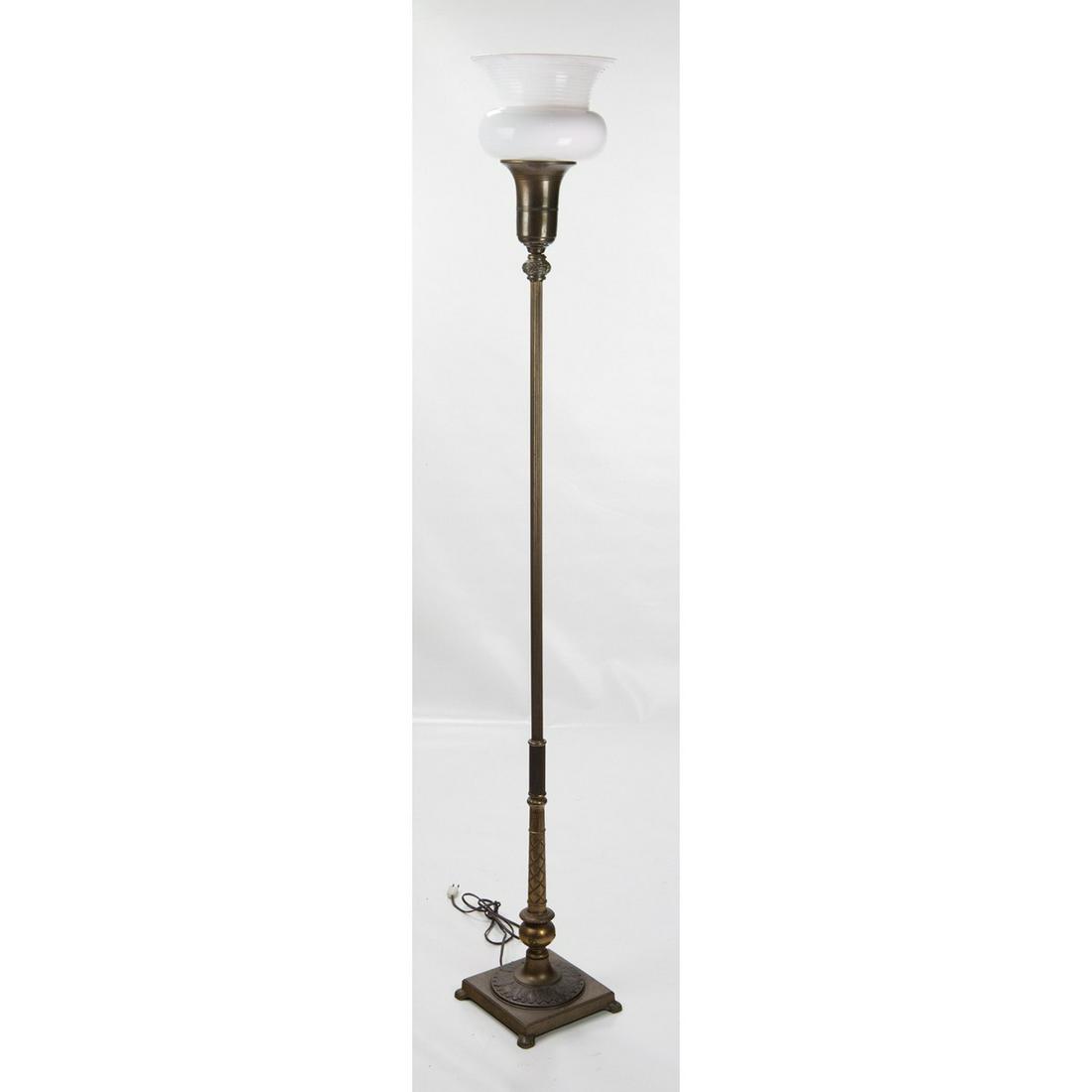1930/40’s Torchiere Floor Lamp: Handsome lamp with the original antique brass finish with a slight art deco inspired design. Has original milk glass shade, lamp made of steel, zinc, cast iron, and antique brass plating. Has a large