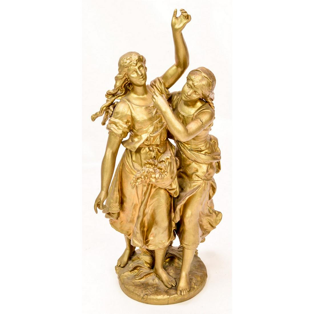 Gold Statue of Two Girls Dancing: Gold color statue of 2 girls dancing. Appears to be made from metal. Note crack in left arm and has been repaired as seen in the photos. A nice display piece. See photos. Measures 22"T x 11.5"W.
