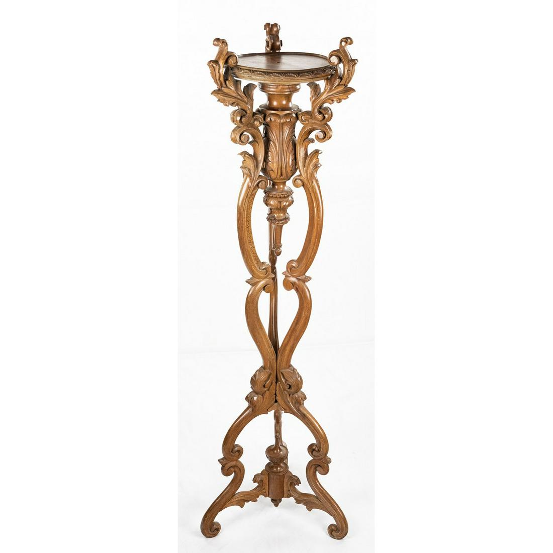 Ornate Wood Pedestal: Ornate wooden pedestal, perfect for indoor house plants or other accessories. One of the 3 feet is broken and will need some repairs to stand up properly. Measures 54"T.