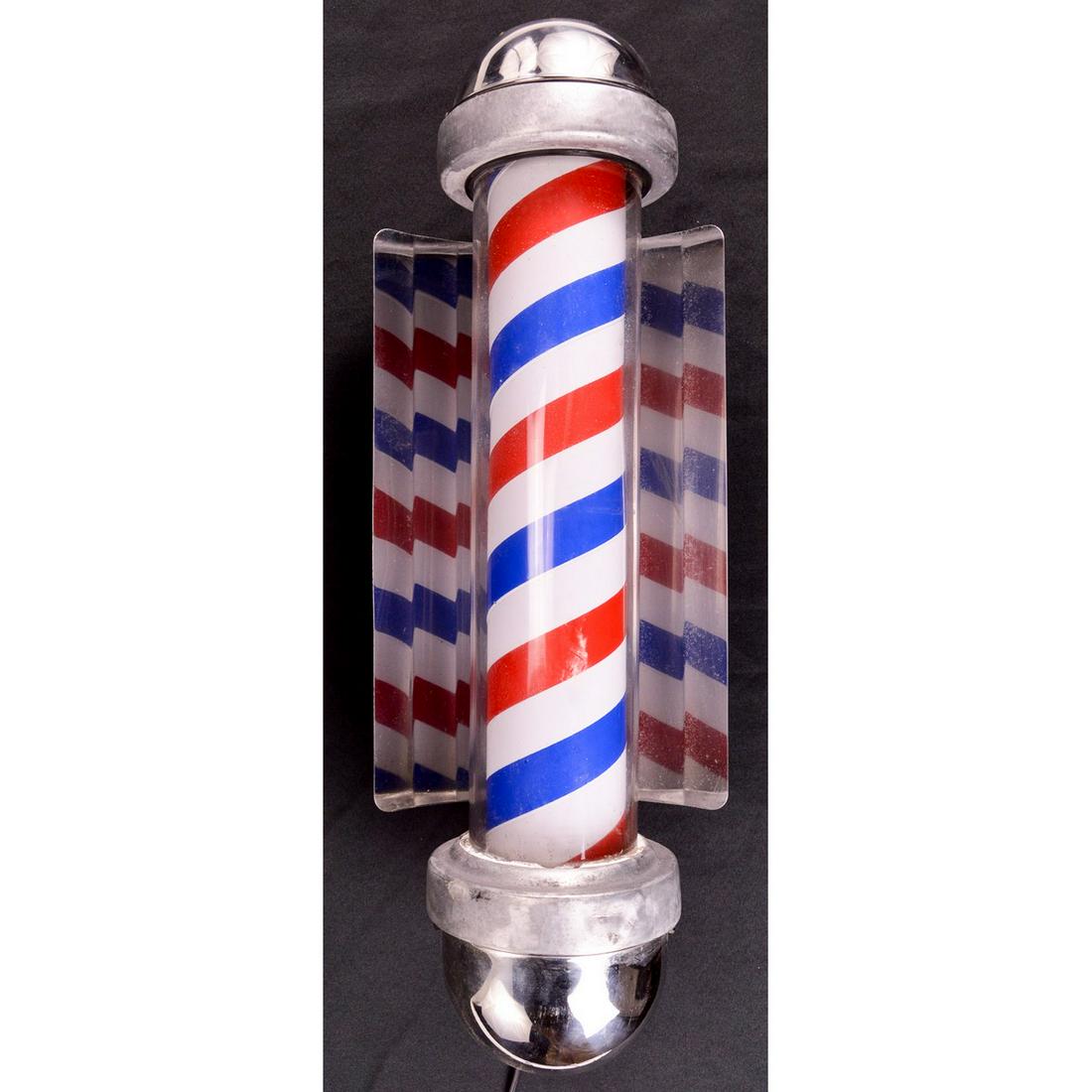 W. Marvy Co. Model 405 Electric Barber Pole: A small electric, wall mounted barber pole complete with mounting bracket and wiring by the William Marvy Company of St. Paul, MN. Bracket has a pair of plates with information for Model 405 barber po