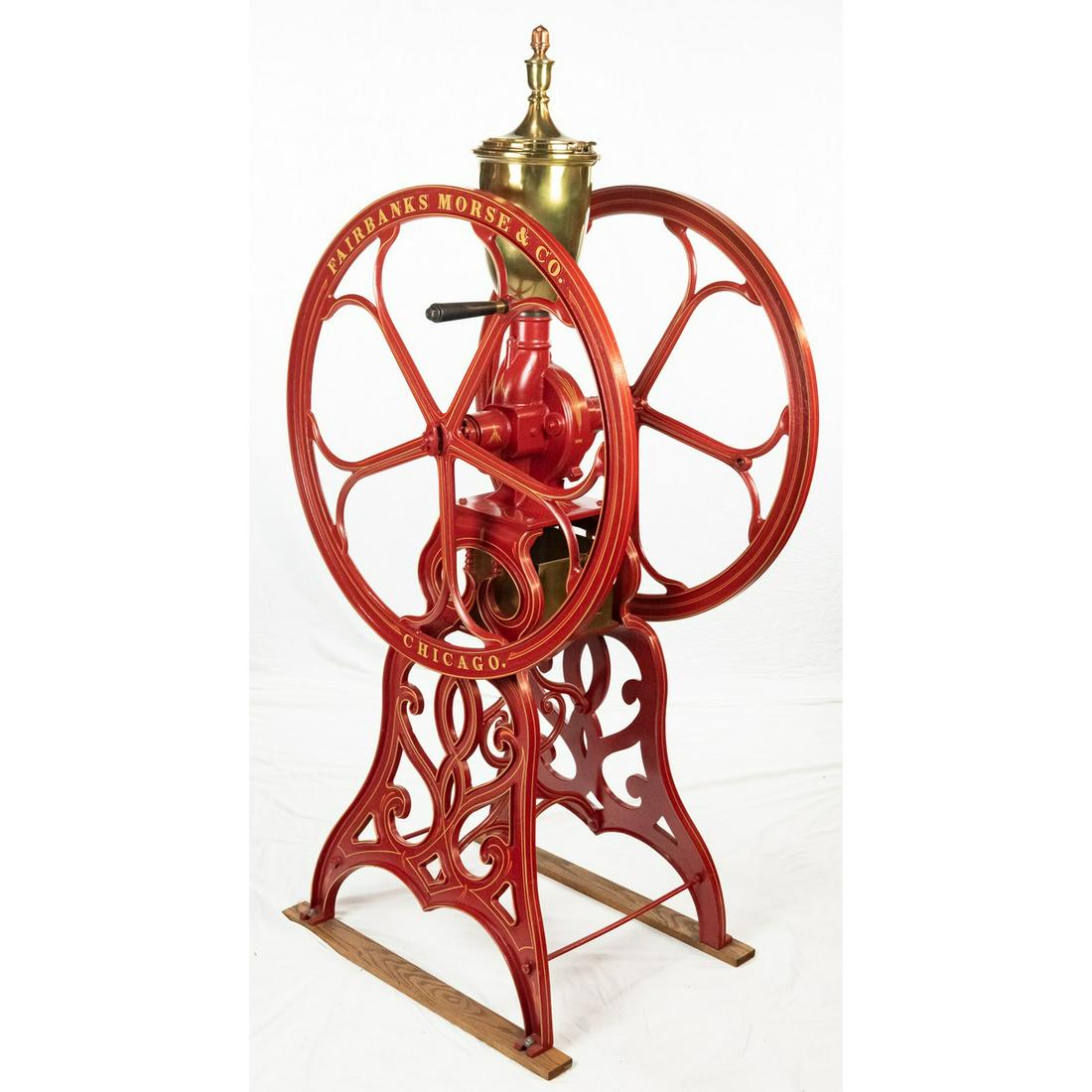 Large Fairbanks Morse & CO. Coffee Grinder: Large cast iron coffee grinder made by Fairbanks Morse & Co. in Chicago. This hand cranked coffee grinder measures about 70"T with 34" wheels. Dated 1894 and comes with catching pan. Paint has been re