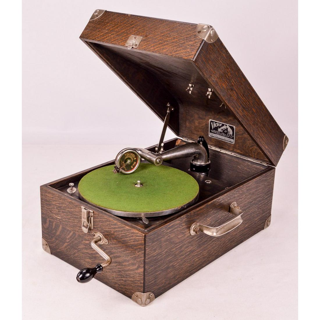 Victor Victrola VV-50 Suitcase Portable Disc Phono: This machine appears to be in untouched and original condition. Has original dark oak finish which is in overall good condition with a few minor scratches here and there. Has Victrola number 2 reprodu