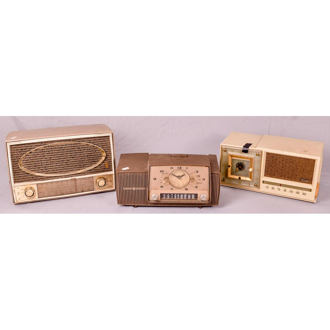 Lot of 3 Vintage Tabletop Tube Radios: Lot contains a General Electric Model C-482B radio tube radio, an Arvin model 657T radio/clock combo, and a Zenith radio with original label worn off. Radios are in overall fair to good cosmetic condi