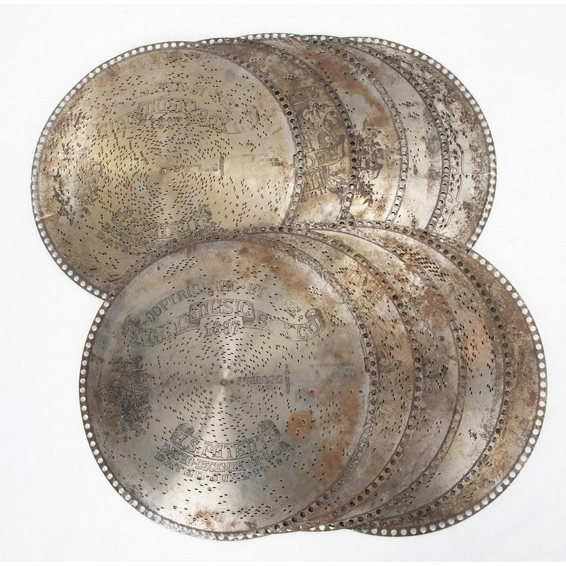 Lot of 15 3/4" Music Box Discs (10): Lot consists of 10 music box discs measuring 15.75" in diameter. Pieces have some rust. See photos.