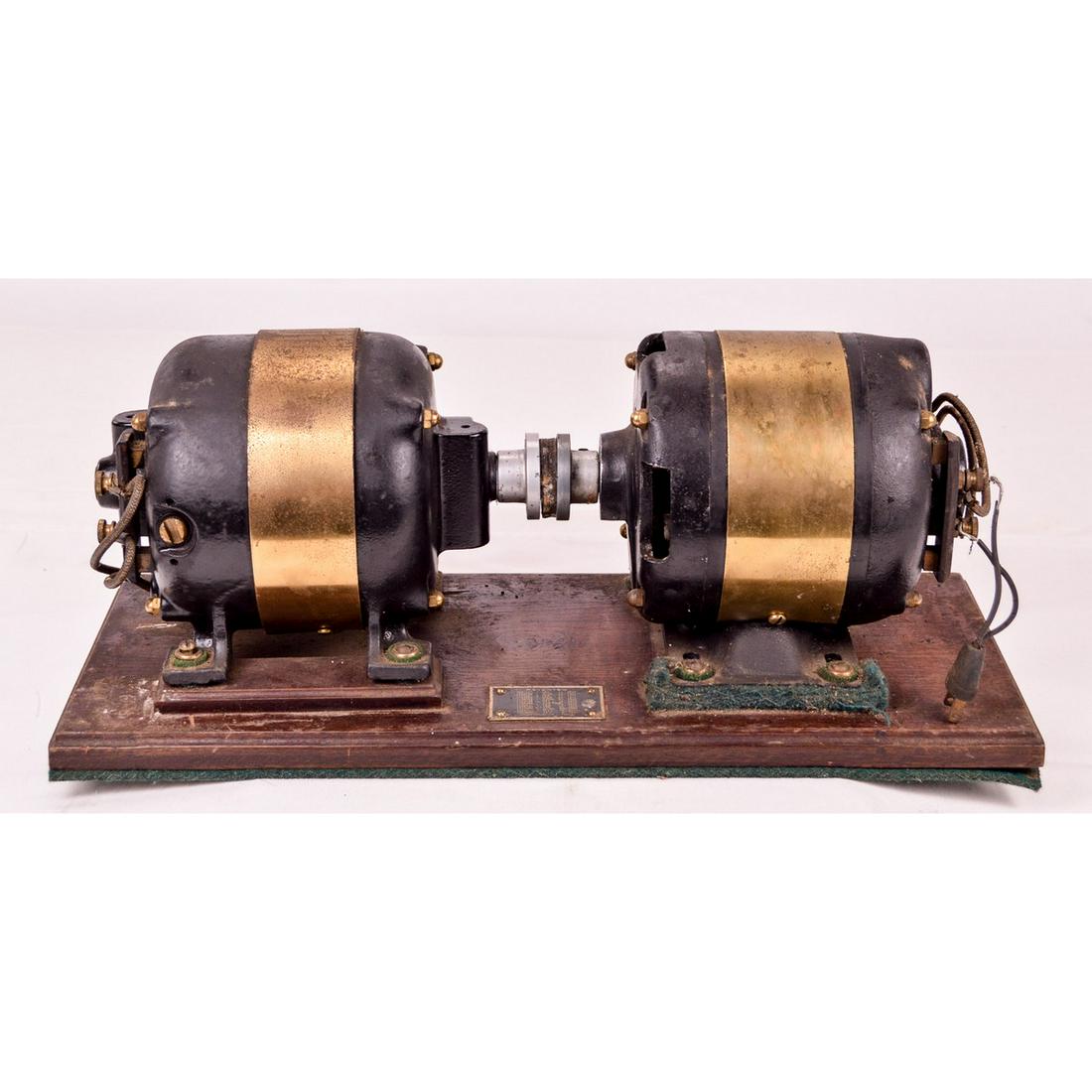 Vintage AC - DC GE / Monarch Generator: A vintage General Electric 110 AC motor coupled with a rare Monarch Electric DC motor, setup as an AC DC generator set. Untested Sold As Is. Appears to feature a newer coupler. Motor shafts turn freel