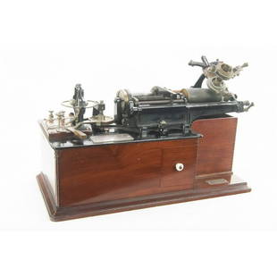 Edison Class M Spectacle Cylinder Phonograph: Circa 1889. Overall good condition. All parts present. Recorder is missing bar, cutting stylus and weight are present but detached from body, glass diaphragm present. Reproducer intact, missing