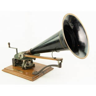 Berliner Open Works Disc Phonograph: At first glance this machine appears to be an early Victor toy model but further investigation shows that it is made with Berliner parts i.e. support and travel arm, top wind, etc. It paints a