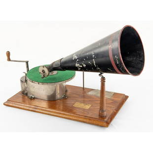 Berliner JS Disc Gramophone: Produced in 1899. Serial No. 468. Overall nice original condition. Original finish oak base with VG decal. Original paper label on base 75%. Good nickel plating on parts. JS stamped on both motor