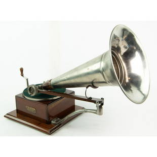 Berliner Trademark Disc Phonograph Mahogany: Unusual and rare Berliner trademark phonograph in mahogany case. Case has been nicely refinished, spring barrel is marked “LG 999”. The original decal is present but very little can be read, see