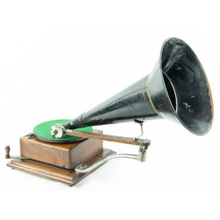 Berliner Gramophone Ratchet Wind Model: Original oak finish, wood base has been re glued. Nickel parts have good original plating, original J reproducer SN 17888 Pat Date Feb 19, 1895, horn support appears to be replaced. Motor is somewhat