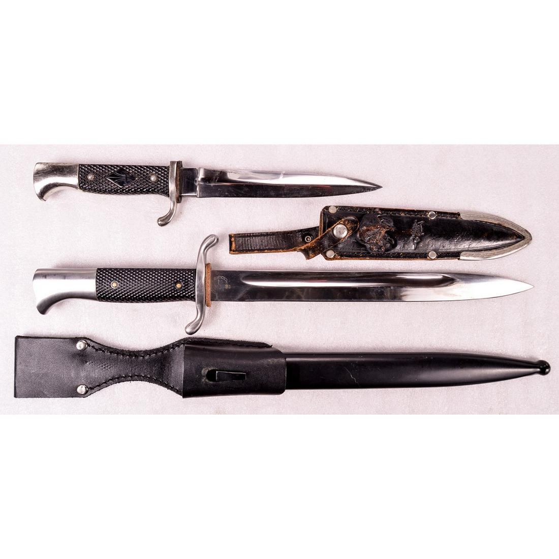 Lot of 2 German Knives: Lot consists of 1 German Buffalo brand knife and 1 modern production Hitler Youth dress bayonet. Dress bayonet has 10" bright blade with scabbard and frog. Grips has Hitler Youth Badge on one side. Bu