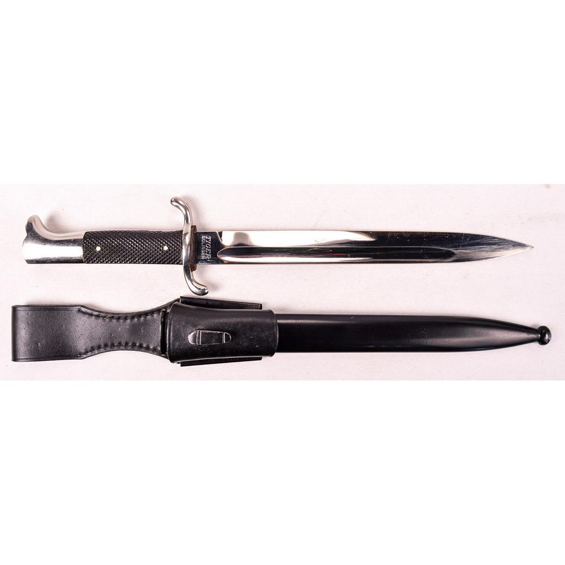 Fireman Dress Bayonet/Dagger: Fireman dress bayonet/dagger complete with frog. Scabbard may have been repainted? Maker marked “TIGER”.