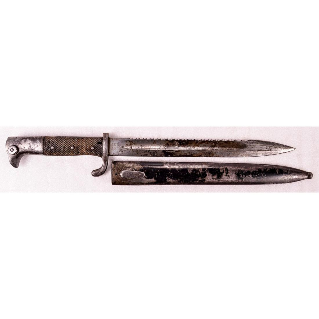 KS 98 German Saw Back Bayonet: Unusual 3 rivet grip possible for combat use. 10" saw back blade blistered from blood, heat, or water damage. Marked W.K. & C. with king and knights head logo. Good tip. Checked grips have slight warp