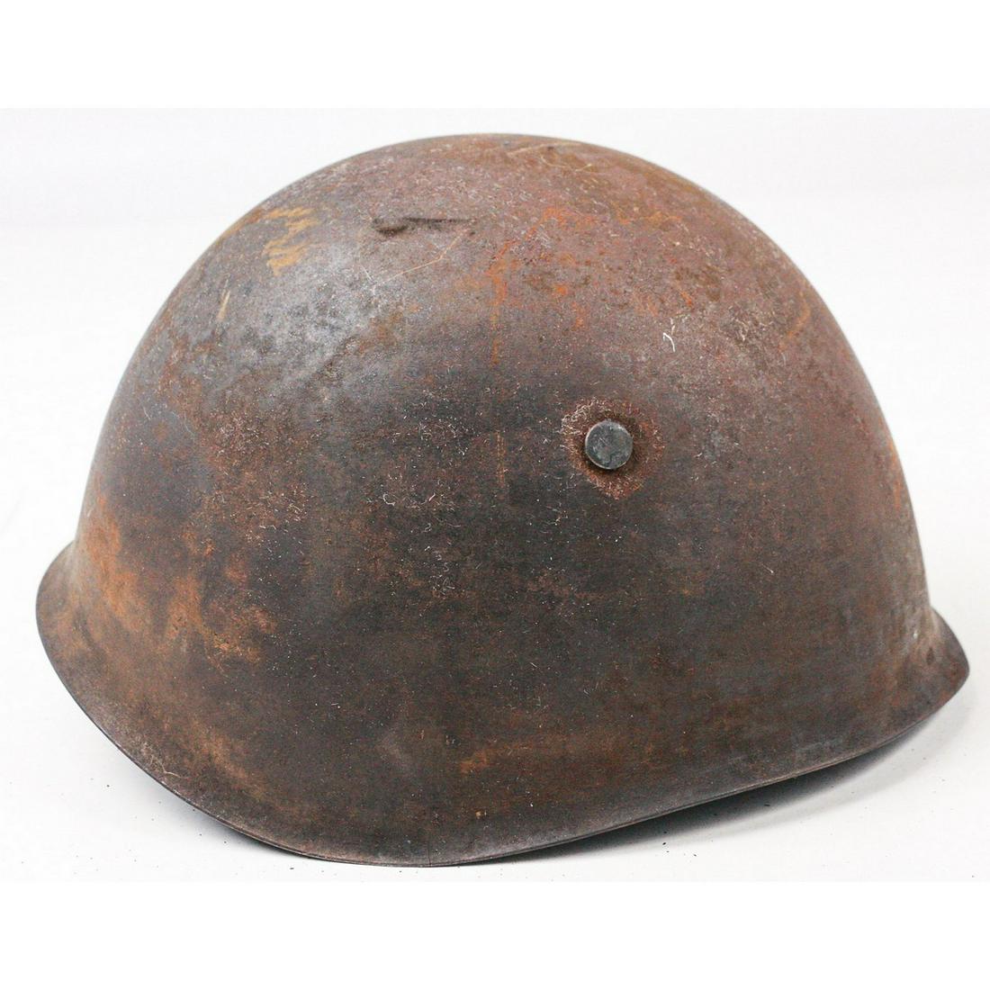 WWII Italian M33 Helmet: WWII Italian M33 helmet. The M33 was the standard issue helmet to most Italian troops and based off the German Stahlhelm. The M33 was not as good as the German design but offered much better protectio