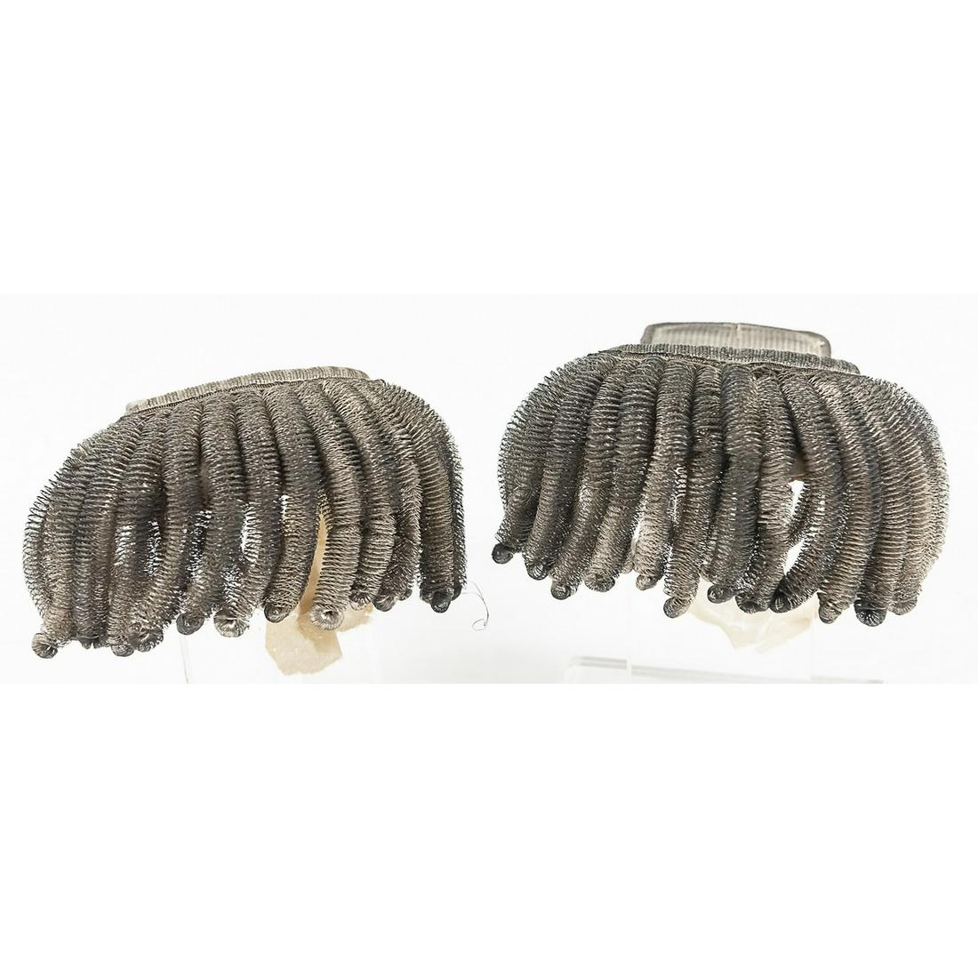 Pair of Silver Fringe Epaulettes: Lot consists of 2 silver fringe epaulettes with outer fringe measuring 0.25" in diameter. No buttons present on either epaulette. Cloth liners on underside are torn and loose. Silver bullion wire semi