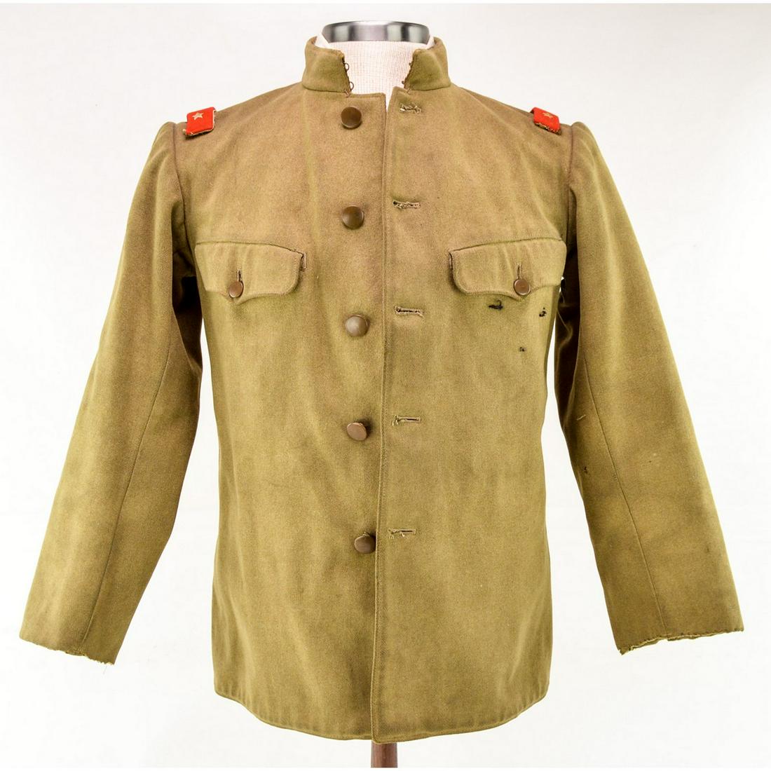 WWII Imperial Japanese Army Tunic: An Imperial Japanese Army tunic with shoulder boards indicating an equivalent rank of Private 1st class. Inside of tunic is marked with Kanji characters both ink stamped and handwritten on inner left 