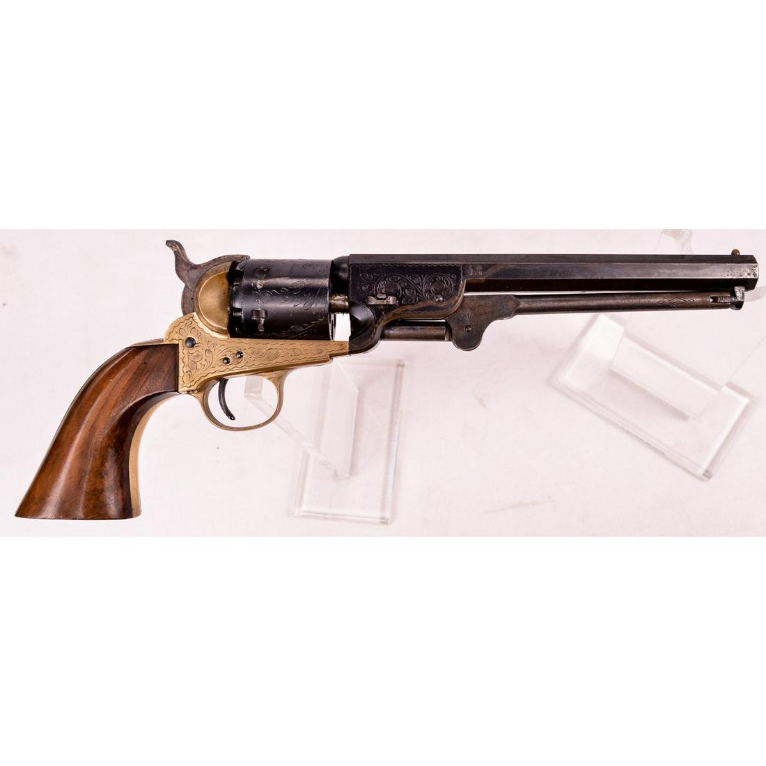 Italian Colt 1851 Navy Repro Revolver .36 (M*): A Italian made reproduction of a Colt 1851 Navy black powder revolver in .36 caliber. Revolver features a 7.5" barrel with nice engraving and SA trigger. Revolver is marked "EIG Navy" on top of barrel