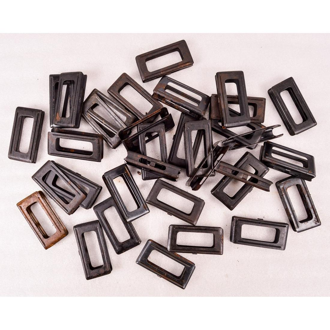 Lot of Italian Carcano En-Bloc Clips: Lot contains 36 en-bloc clips for the Carcano rifles. Most are marked "SMI" or "RR". Clips are in overall fair to good condition with some rust present on some clips. See photos.