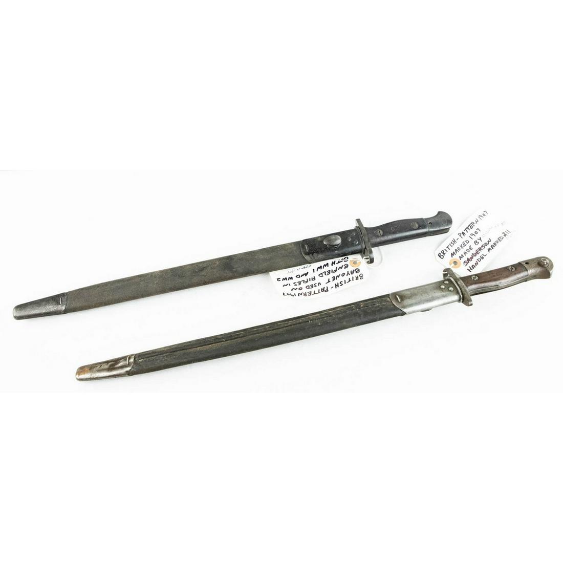Lot of 2 British P1907 Bayonets: Lot consists of 2 British Pattern 1907 bayonets with one made in 1915 and the other made in May 1918 by Wilkinson. Second bayonet has scarce unit marking "BURC" and is very nice though there is a smal