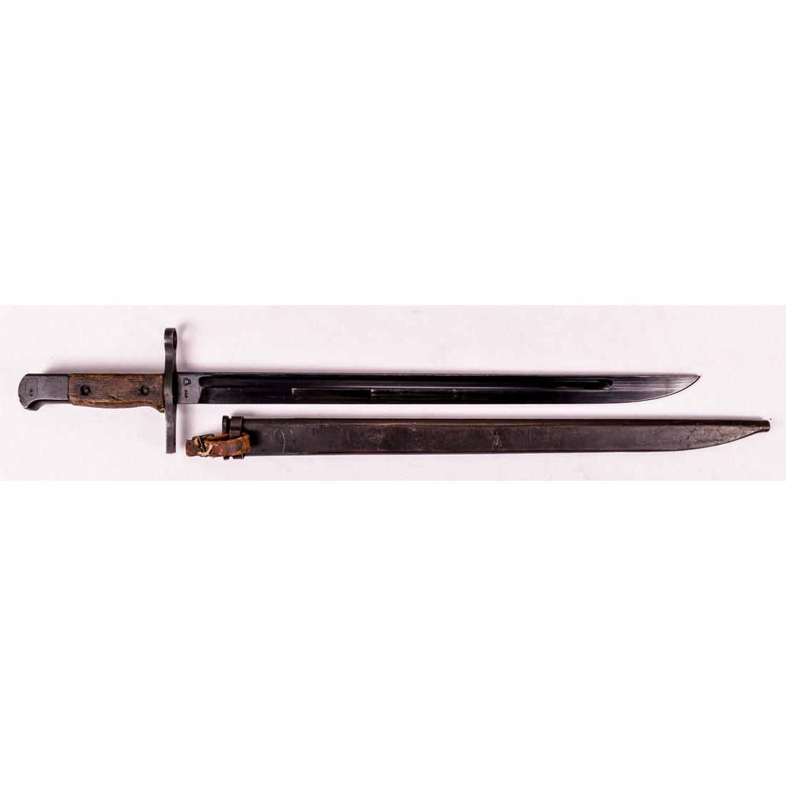 Japanese Mid War Type 30 Bayonet: A Japanese Type 30 bayonet produced during WWII by National Denki under Kokura supervision. Bayonet features a 15.75" blade with straight cross guard and curved pommel. Blued finish on blade is in exc
